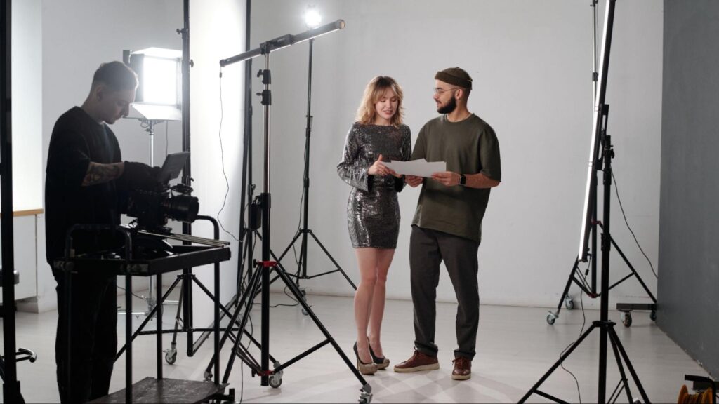 Filming crew preparing video content with professional lighting and cameras for marketing campaigns