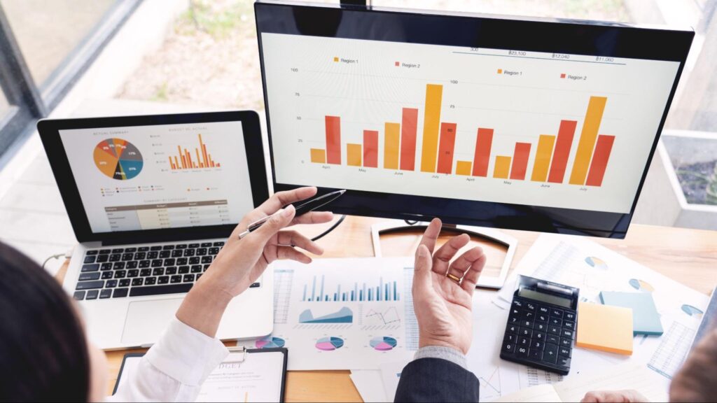Analytics dashboards showing charts and performance metrics used to measure ROI and improve a digital marketing strategy.